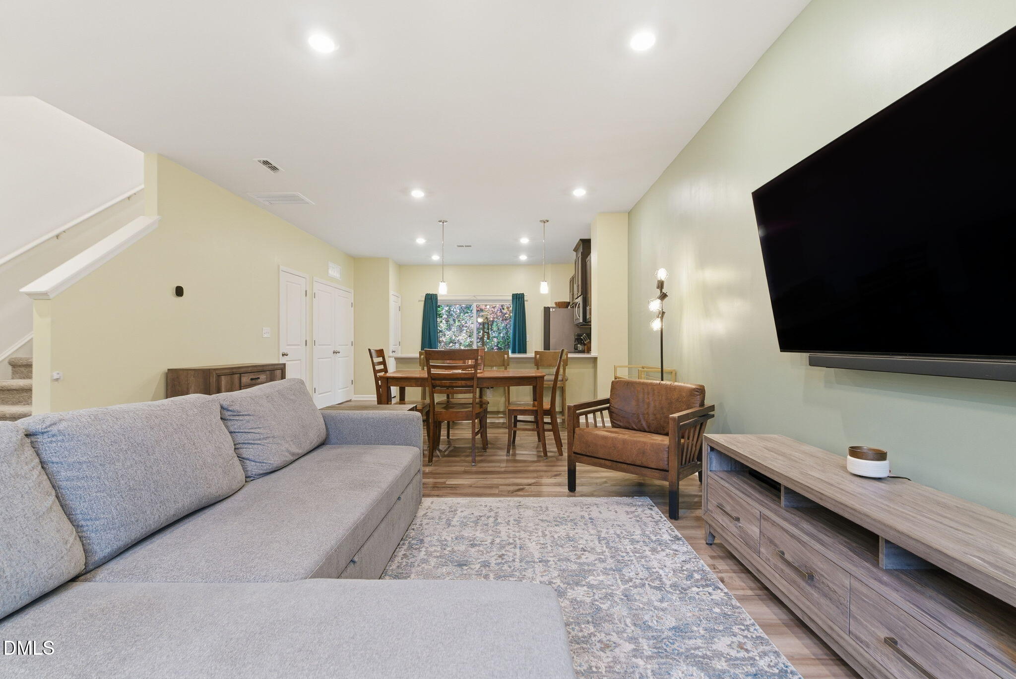 449 Hacksaw Trail Raleigh, NC 27610 - Photo 9 of 36 a living room with furniture and a flat screen tv