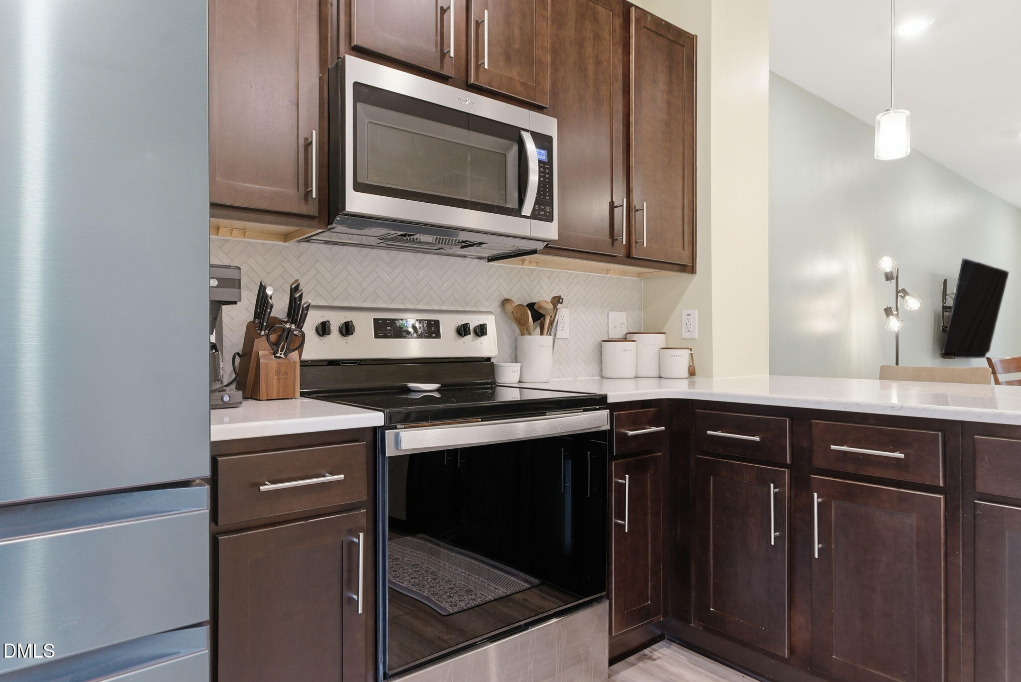 449 Hacksaw Trail Raleigh, NC 27610 - Photo 17 of 36 a kitchen with stainless steel appliances granite countertop a sink stove and microwave