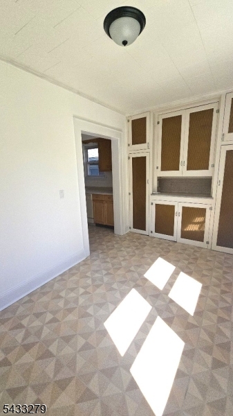 362 Columbia Boulevard Wood-Ridge, NJ 07075 - Photo 6 of 13 a view of an empty room with a window