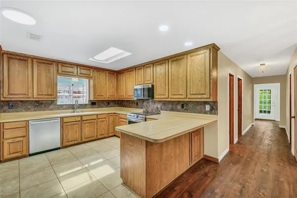a kitchen with a sink and cabinets