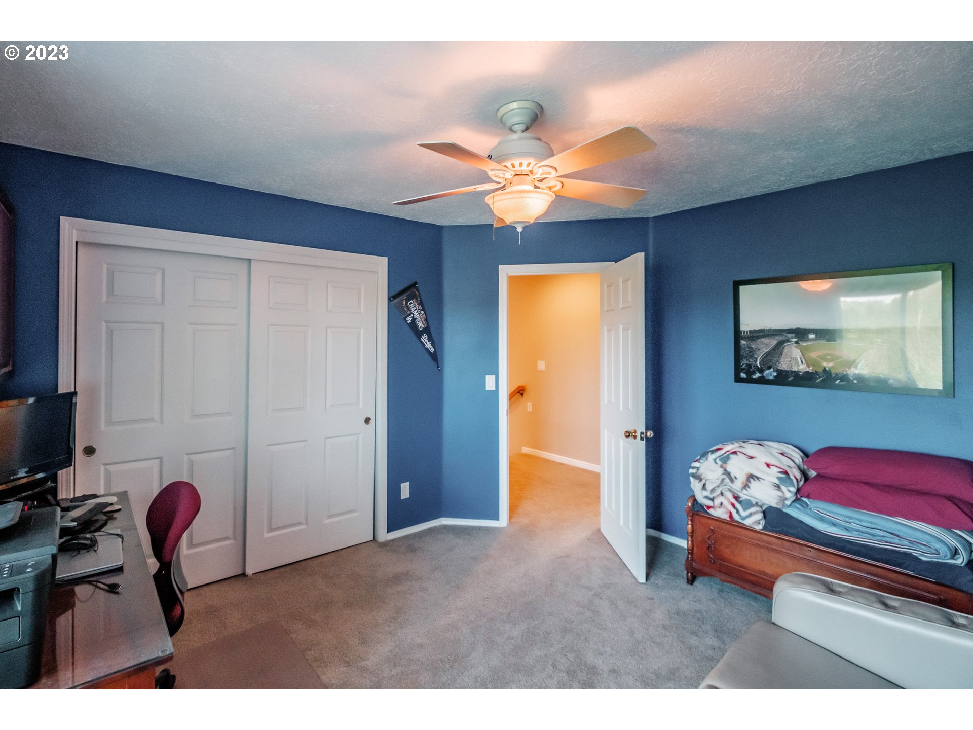 5165 Falcon Street Southwest Albany, OR 97321 - Photo 19 of 28 a bedroom with a bed and a chandelier