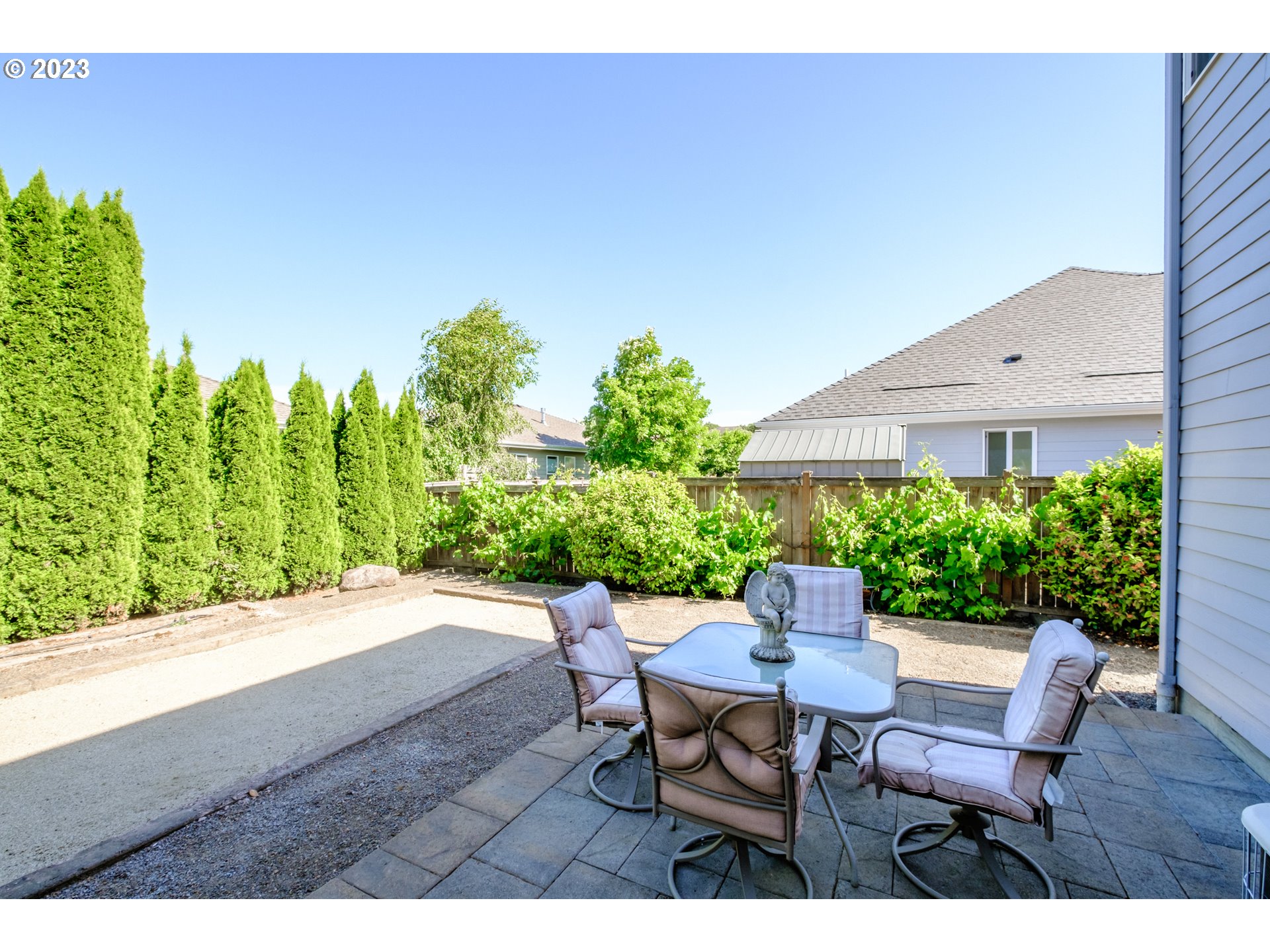 5165 Falcon Street Southwest Albany, OR 97321 - Photo 27 of 28 a view of a patio with table and chairs and potted plants