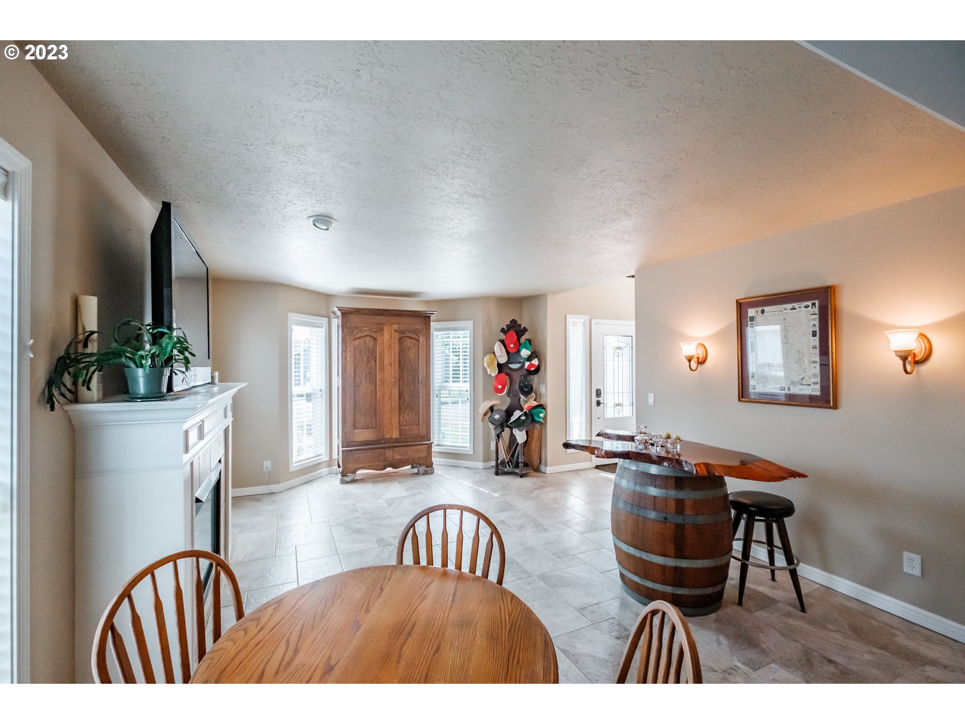 5165 Falcon Street Southwest Albany, OR 97321 - Photo 5 of 28 a living room with furniture a window and a flat screen tv