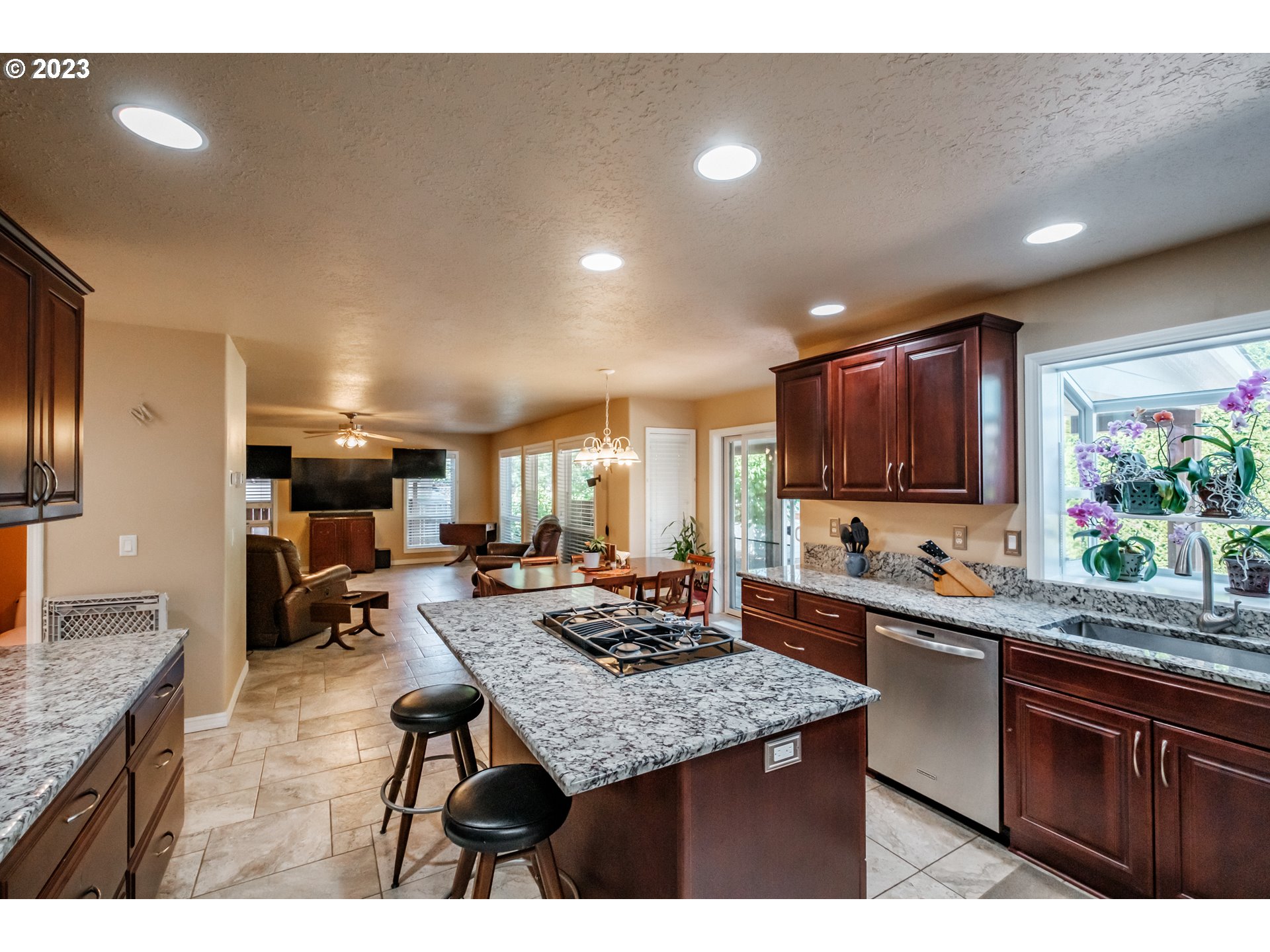 5165 Falcon Street Southwest Albany, OR 97321 - Photo 6 of 28 a kitchen with lots of counter top space sink stove and living room