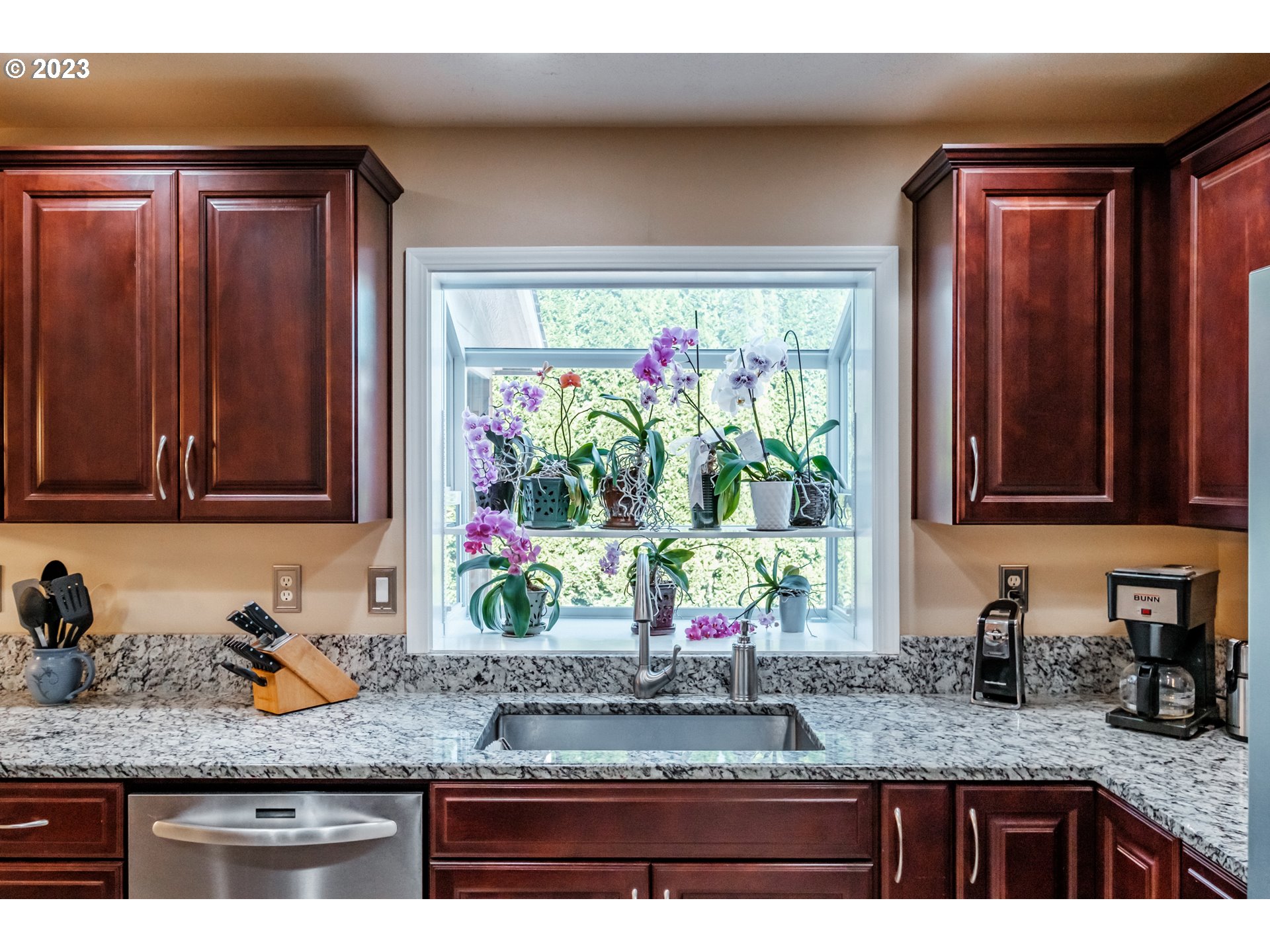 5165 Falcon Street Southwest Albany, OR 97321 - Photo 8 of 28 a kitchen with granite countertop stainless steel appliances a sink window and cabinets