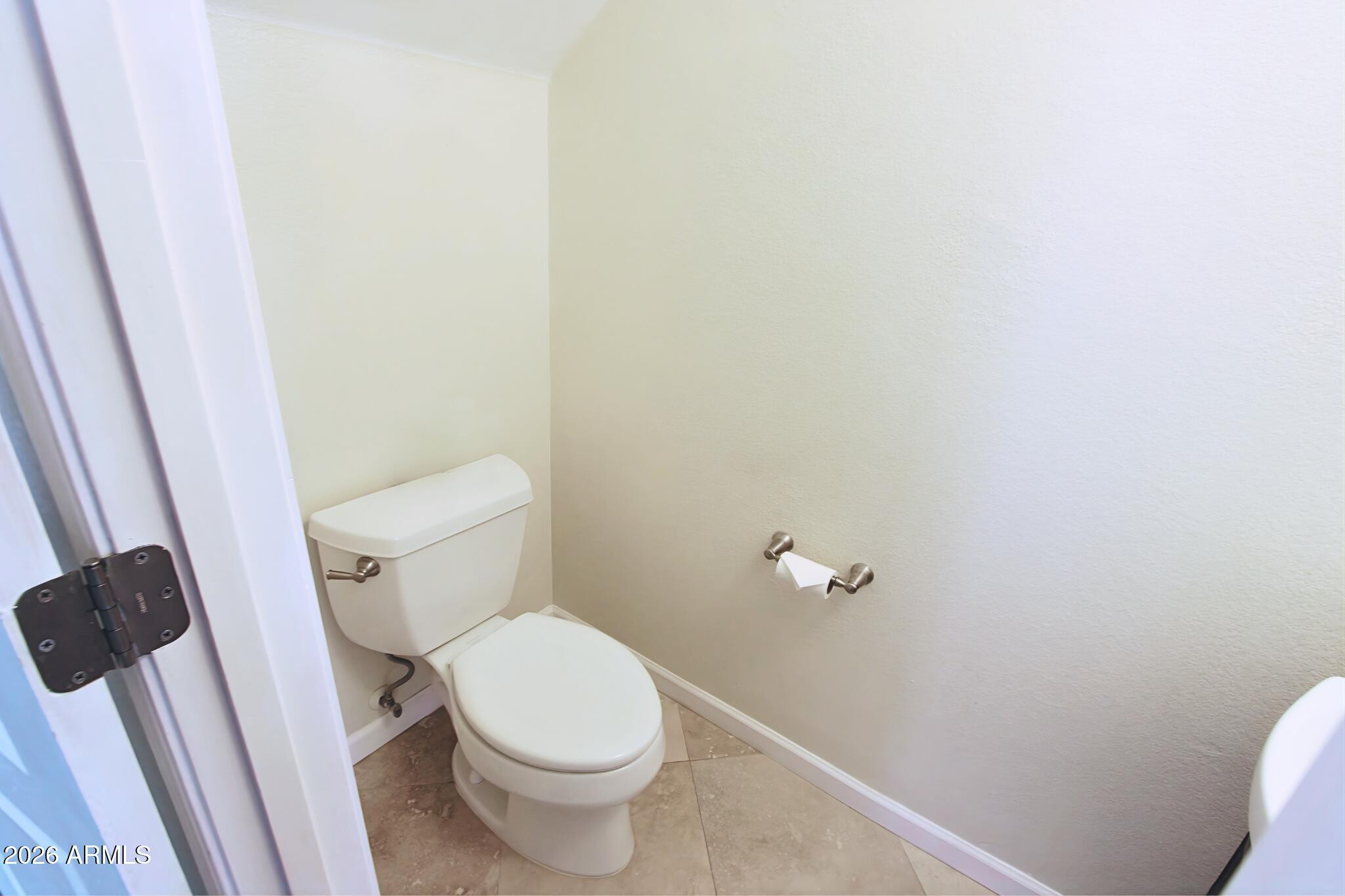 1250 South Palm Street Gilbert, AZ 85296 - Photo 15 of 33 a white toilet sitting next to a shower