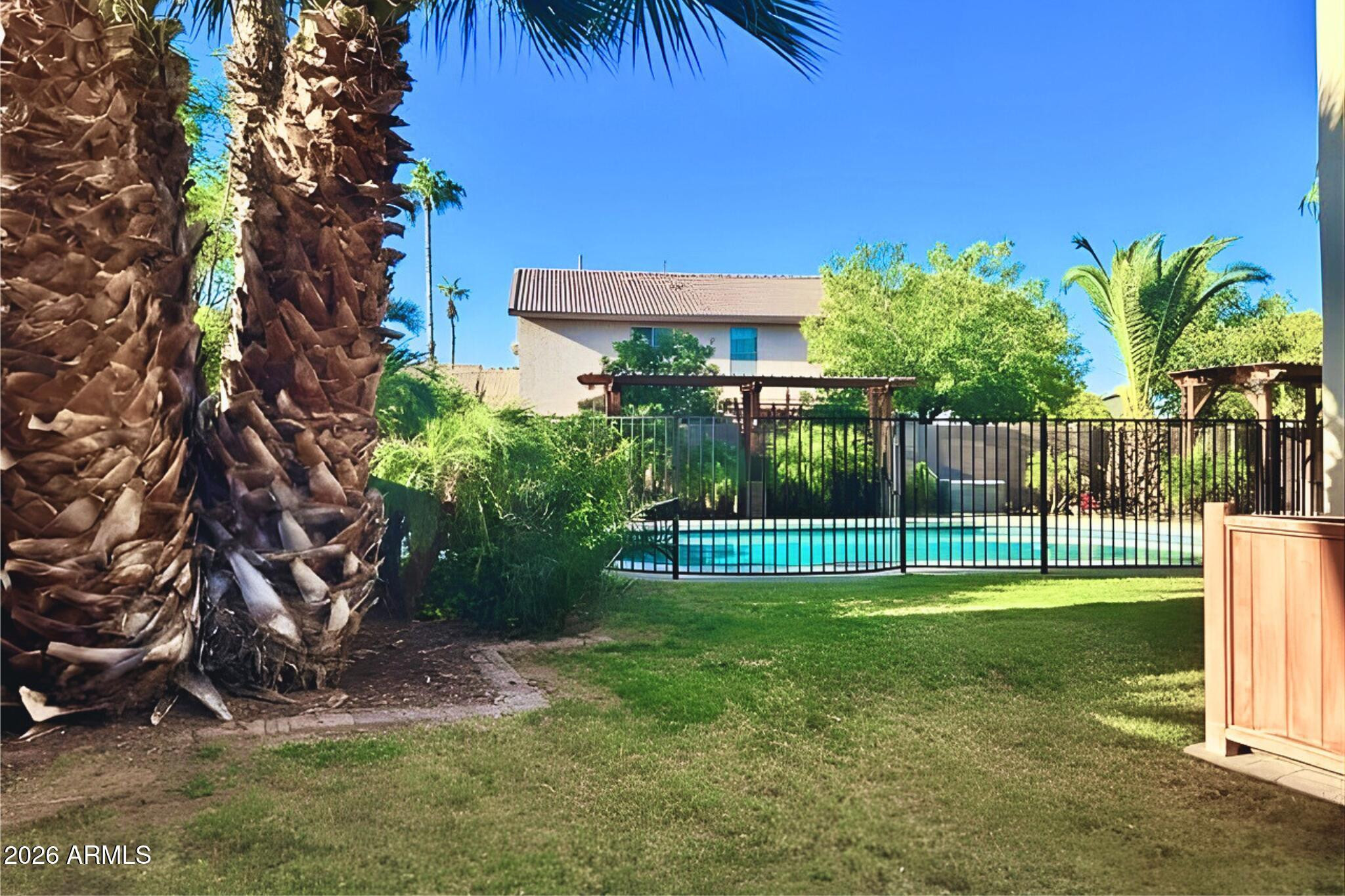 1250 South Palm Street Gilbert, AZ 85296 - Photo 21 of 33 a view of a backyard with a garden