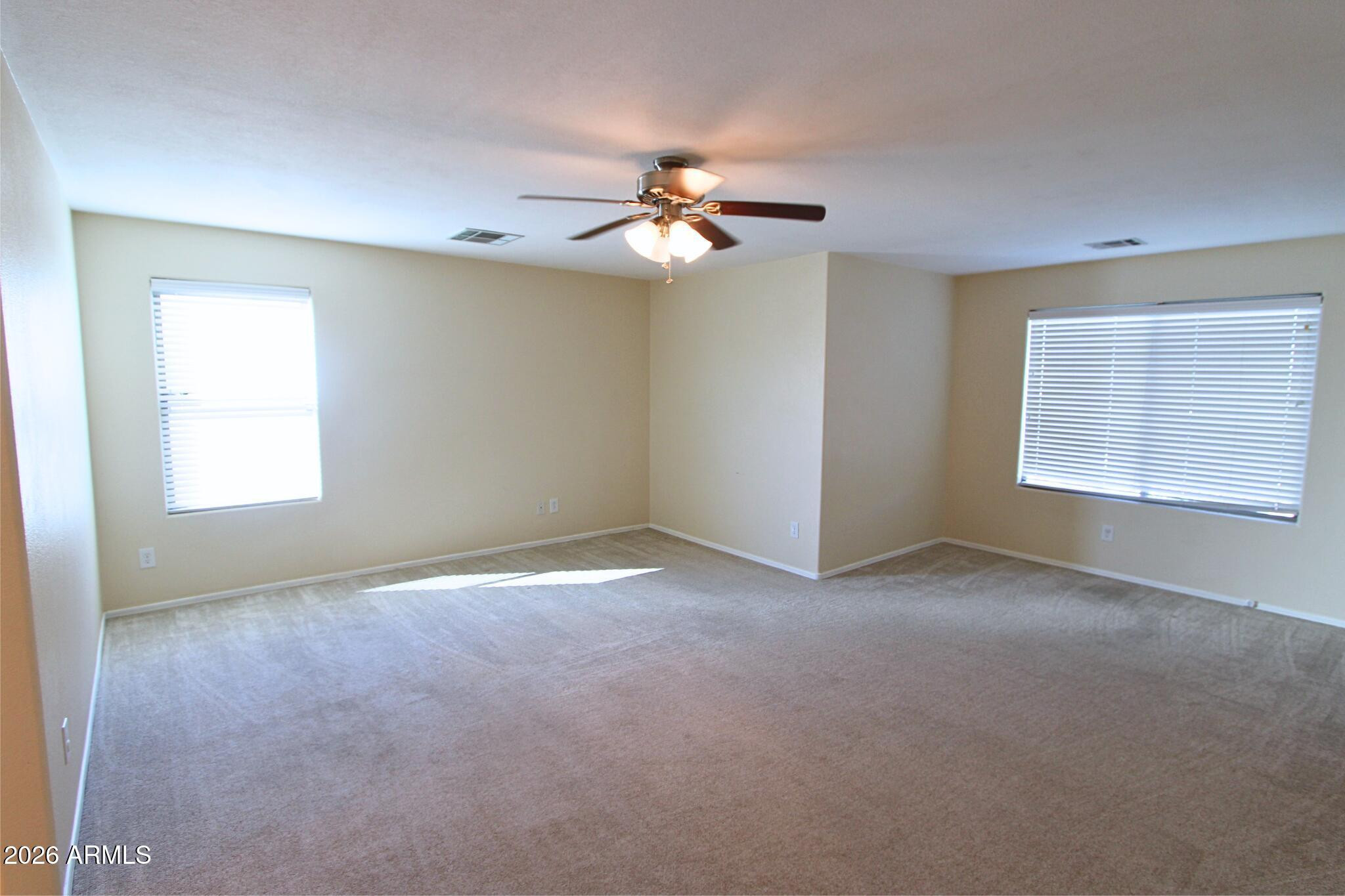 1250 South Palm Street Gilbert, AZ 85296 - Photo 26 of 33 an empty room with windows and fan