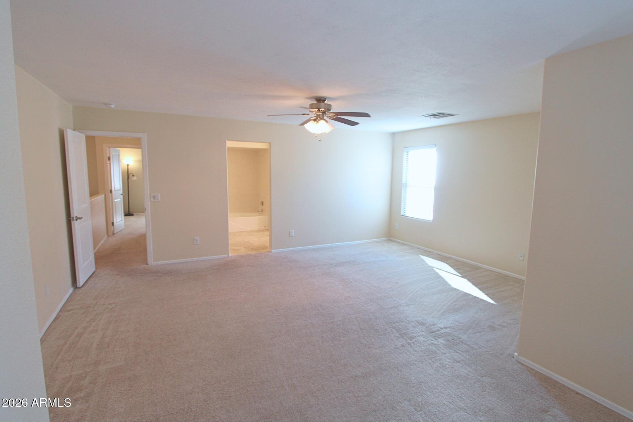 1250 South Palm Street Gilbert, AZ 85296 - Photo 27 of 33 a view of a big room with windows and chandelier fan