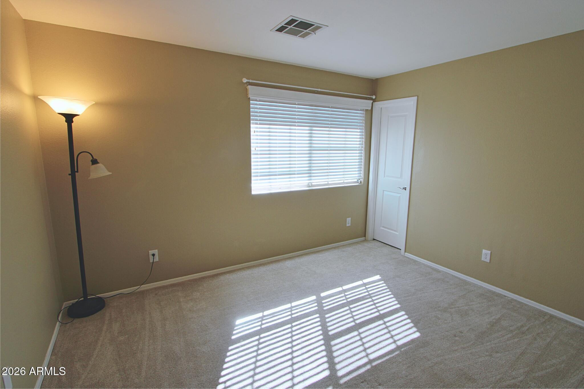 1250 South Palm Street Gilbert, AZ 85296 - Photo 31 of 33 a view of room with window and a ceiling fan