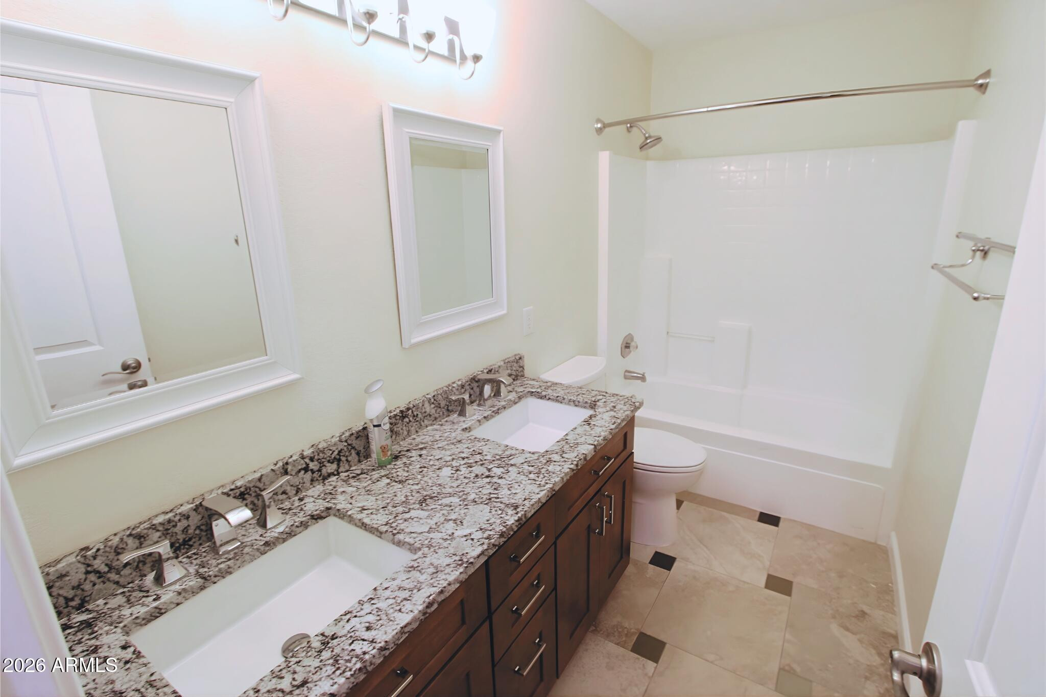 1250 South Palm Street Gilbert, AZ 85296 - Photo 32 of 33 a bathroom with a granite countertop sink a mirror and shower