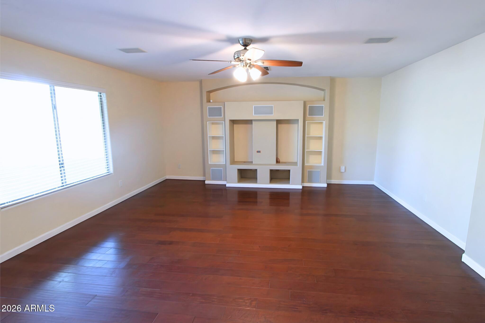 1250 South Palm Street Gilbert, AZ 85296 - Photo 7 of 33 wooden floor in an empty room with a window