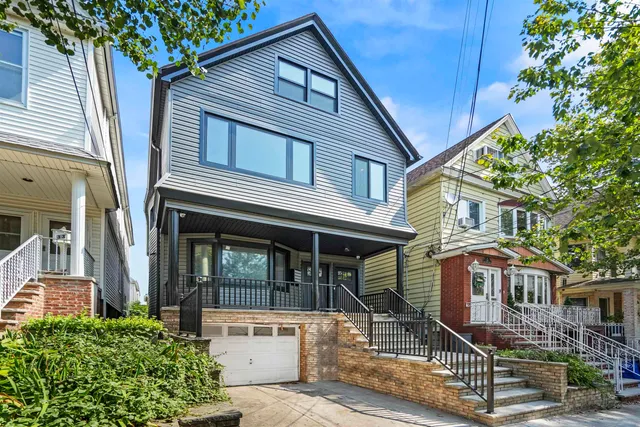 a front view of a house with glass windows