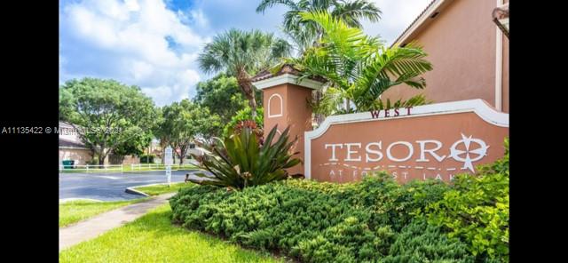 16453 Southwest 97th Street Miami, FL 33196 - Photo 2 of 5 a sign of golf club on a wall under a tree