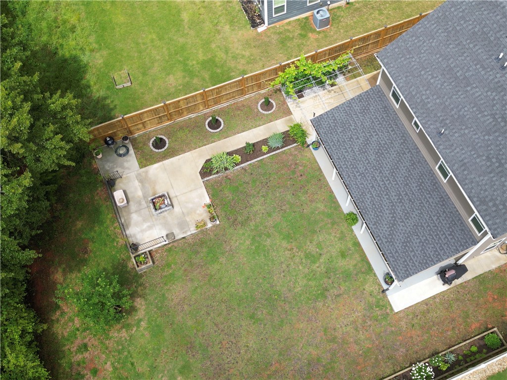 224 Bronson Ridge Anderson, SC 29621 - Photo 38 of 42 An aerial perspective reveals a well-maintained yard, patio with a fire pit, and thoughtfully designed landscaping.