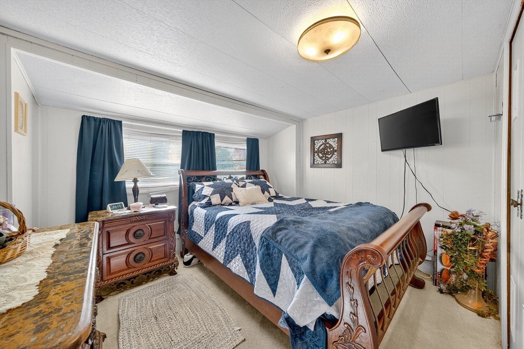 59 Timber Lane Wareham, MA 02576 - Photo 19 of 30 a bedroom with a bed and a television