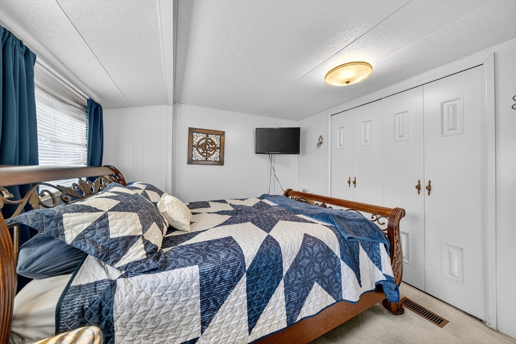 59 Timber Lane Wareham, MA 02576 - Photo 20 of 30 a bedroom with a bed and a window