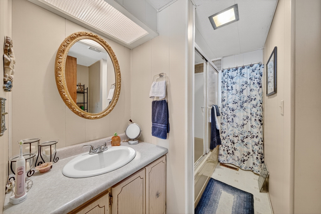 59 Timber Lane Wareham, MA 02576 - Photo 29 of 30 a bathroom with a sink and a mirror