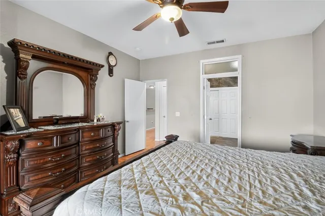 a bedroom with a bed and a dresser