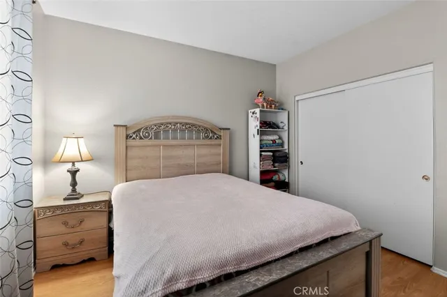 a bedroom with a bed and a closet