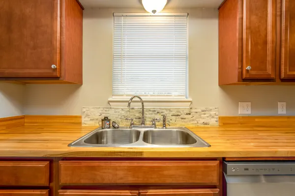 a bathroom with a sink and a window