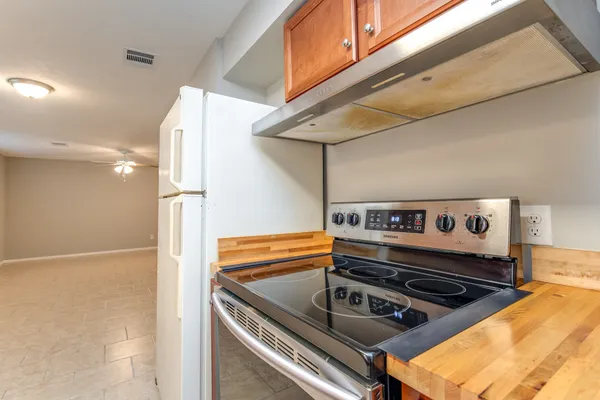 a kitchen with a stove and a microwave