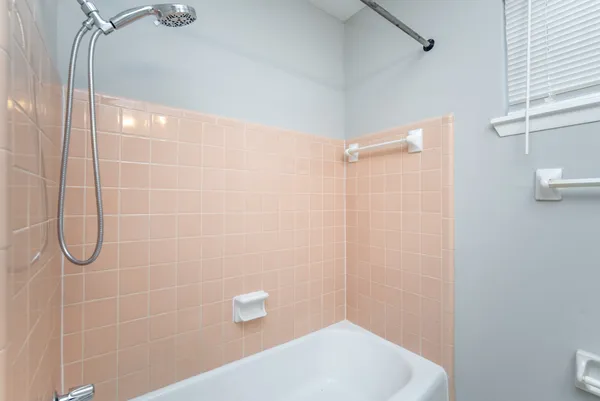 a bathroom with a shower and a toilet