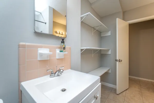 a bathroom with a sink and a mirror
