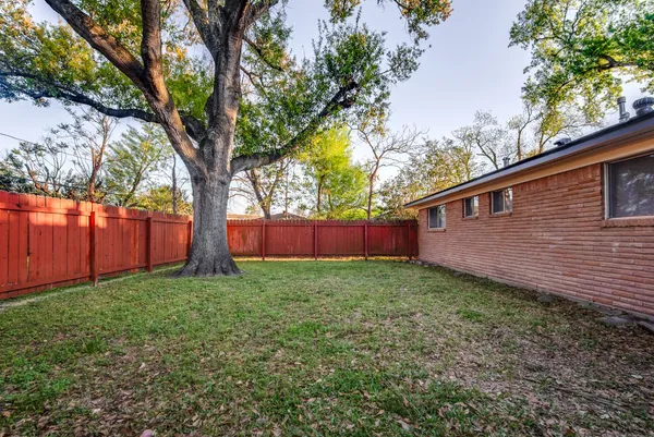 a backyard of a house with lots of green space