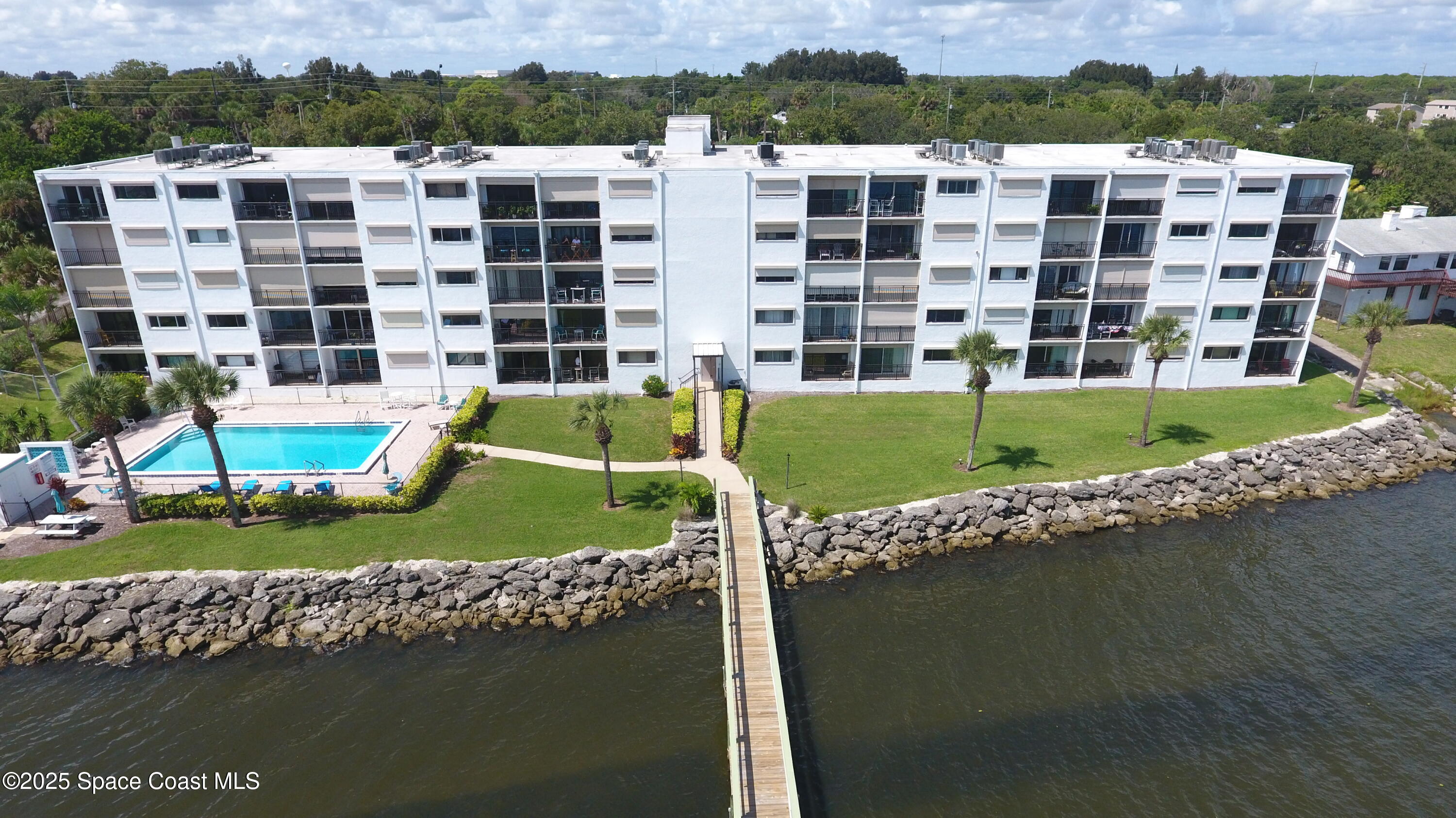 a view of a large building with a yard