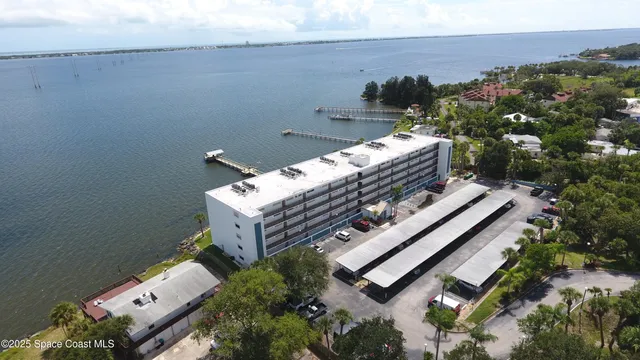 a view of a balcony with two chairs
