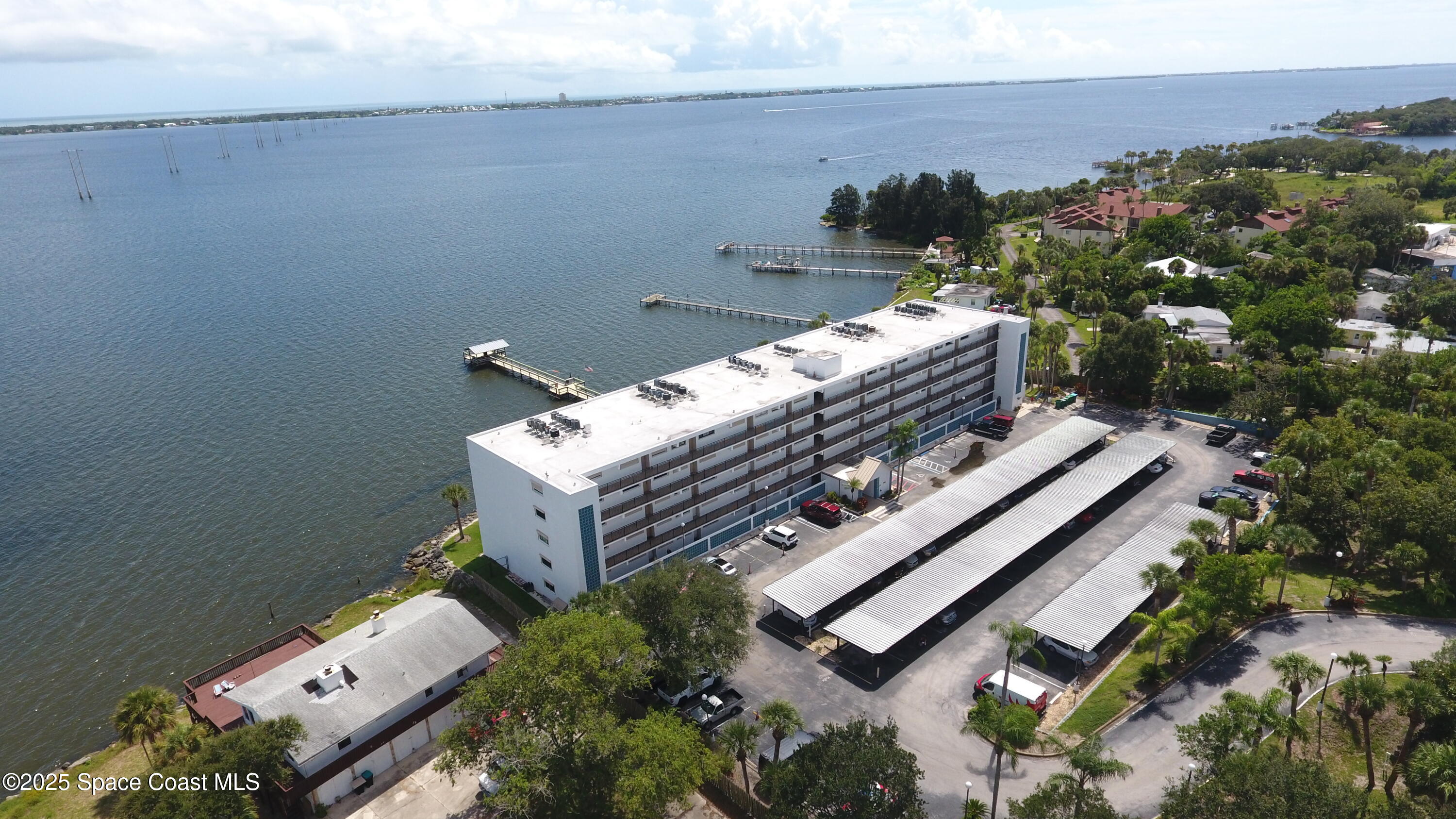 3901 Dixie Highway Northeast, Unit 402 Palm Bay, FL 32905 - Photo 13 of 33 an aerial view of a house with a yard