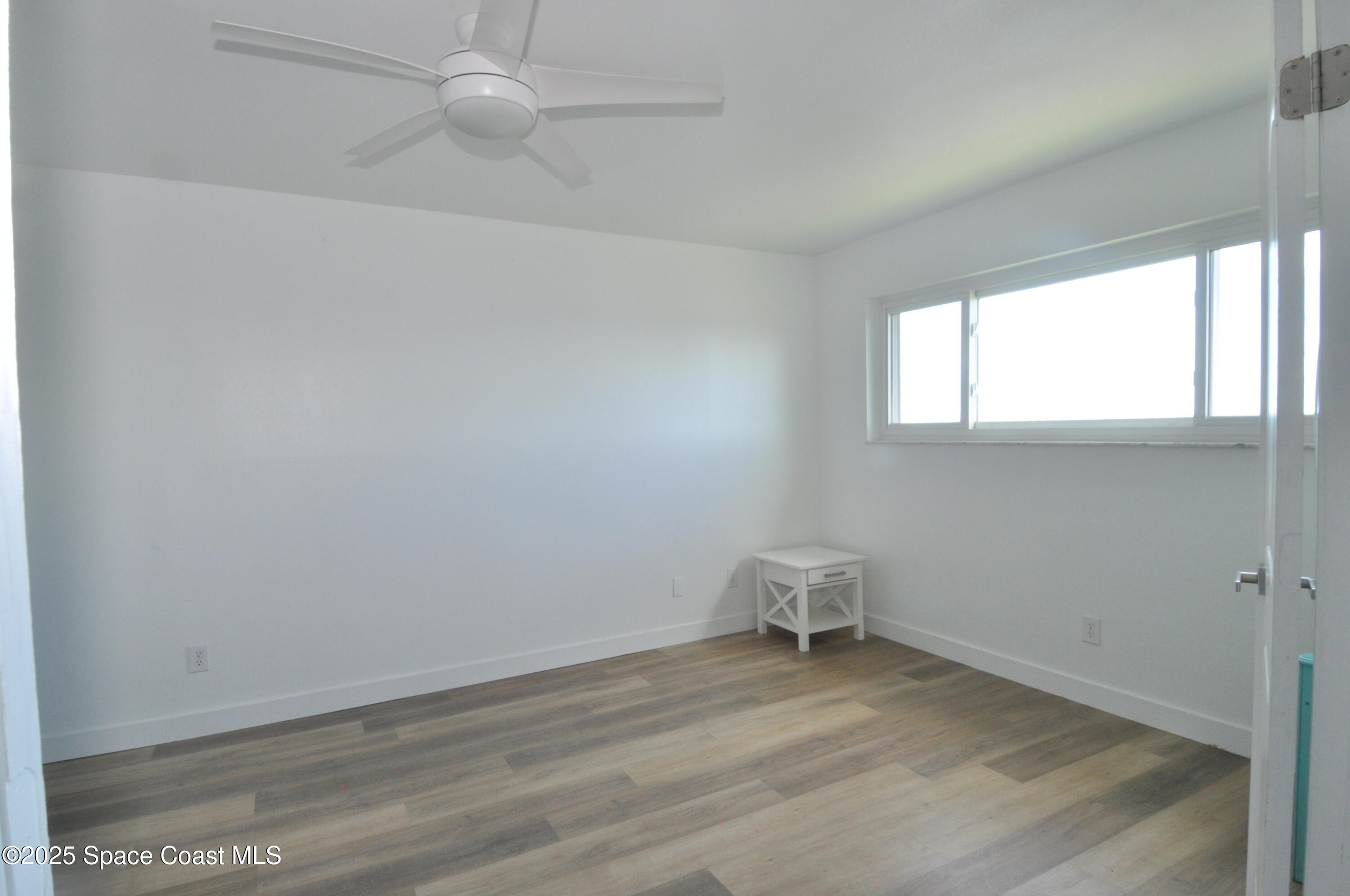 3901 Dixie Highway Northeast, Unit 402 Palm Bay, FL 32905 - Photo 23 of 33 an empty room with a window