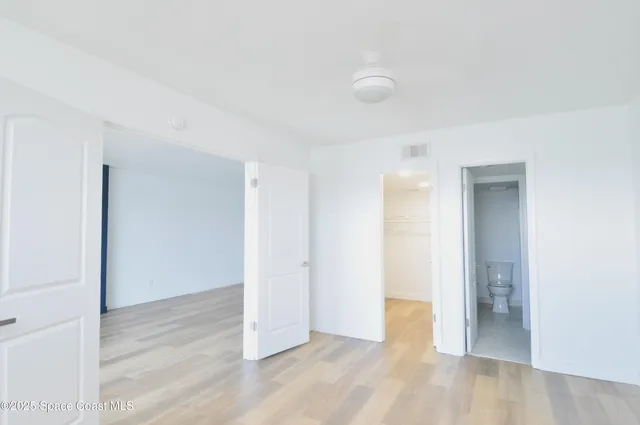 a view of a livingroom with wooden floor