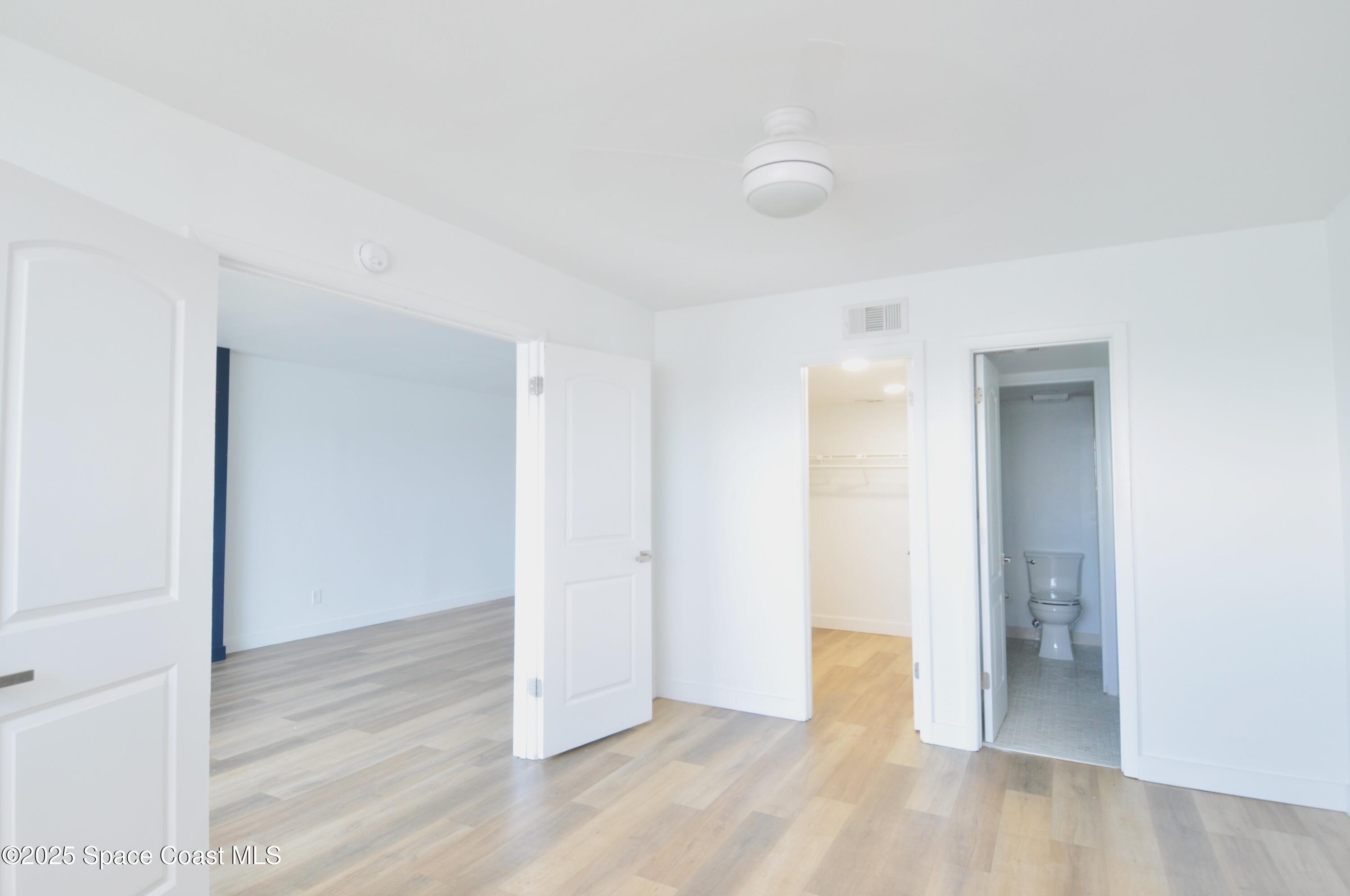 3901 Dixie Highway Northeast, Unit 402 Palm Bay, FL 32905 - Photo 27 of 33 a view of an empty room with wooden floor