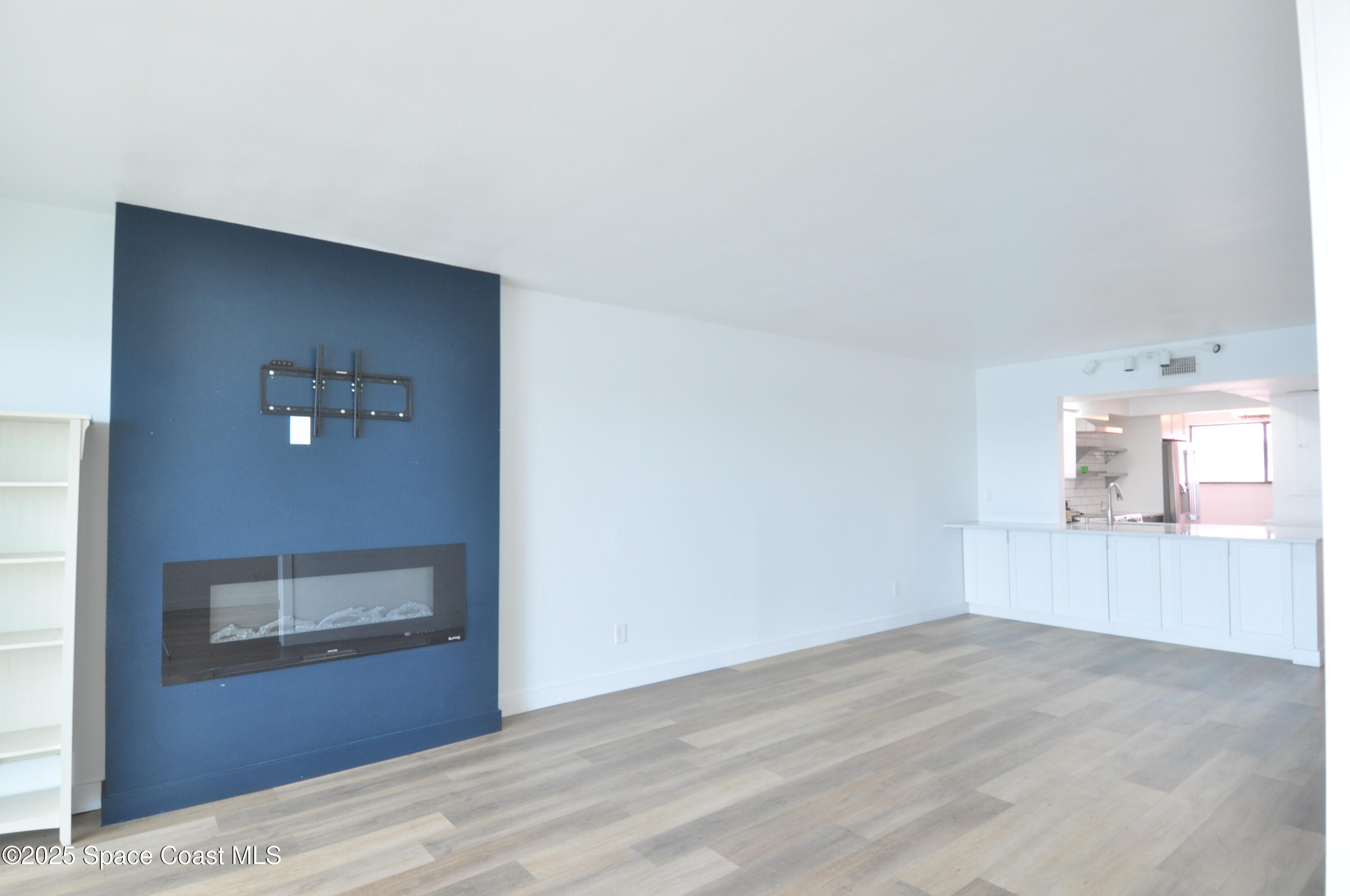 3901 Dixie Highway Northeast, Unit 402 Palm Bay, FL 32905 - Photo 28 of 33 a view of a livingroom with wooden floor