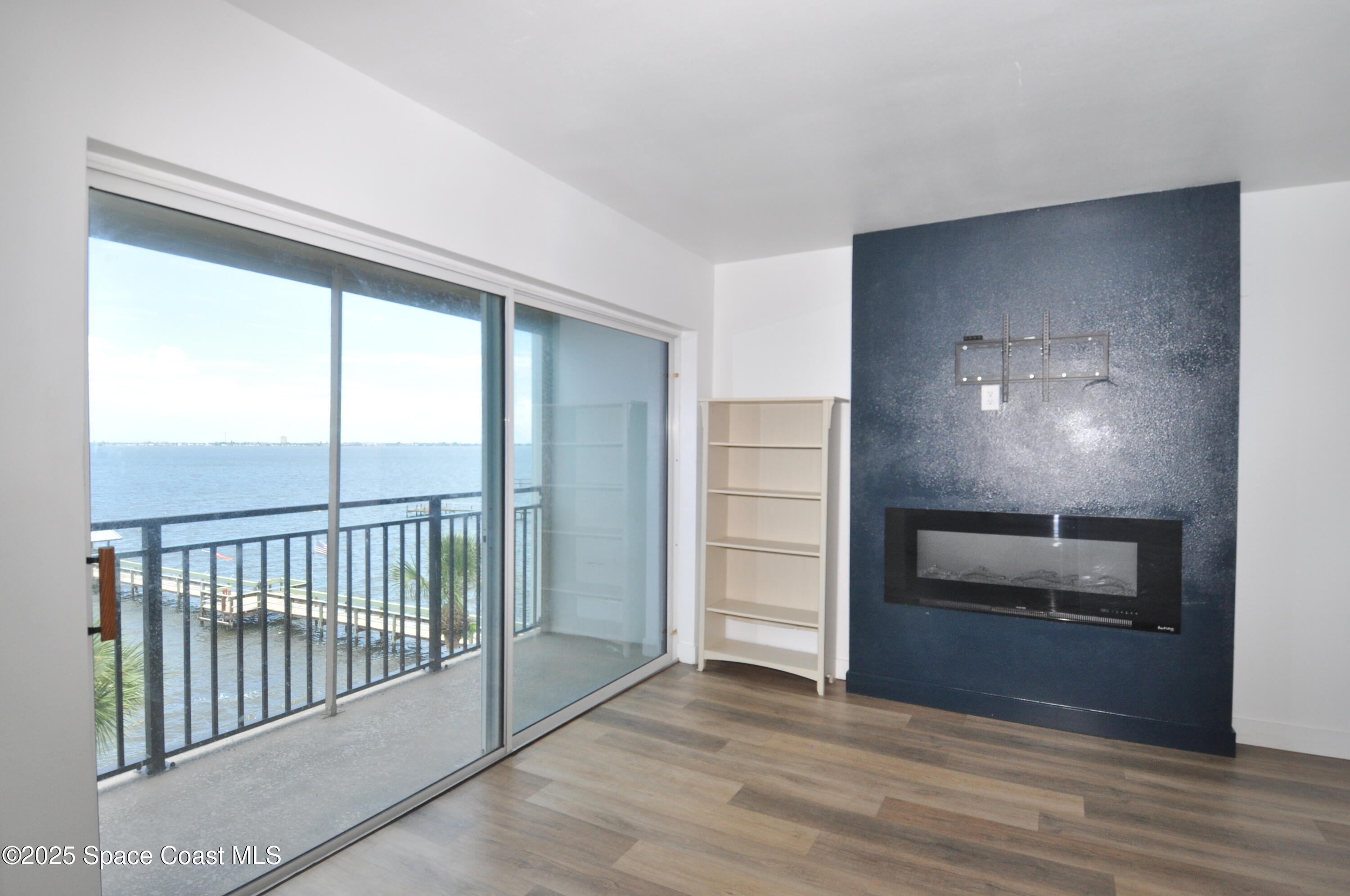 3901 Dixie Highway Northeast, Unit 402 Palm Bay, FL 32905 - Photo 29 of 33 a view of an empty room and kitchen