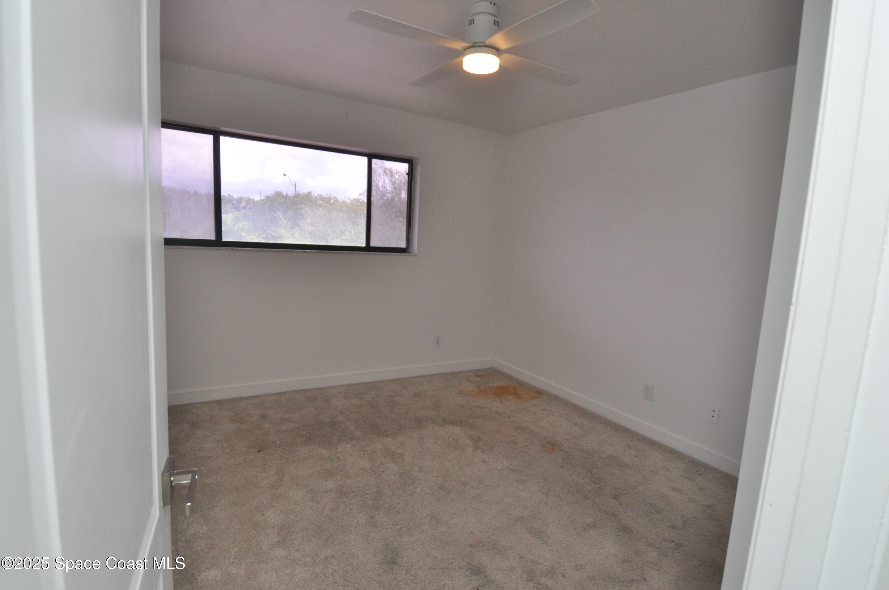 3901 Dixie Highway Northeast, Unit 402 Palm Bay, FL 32905 - Photo 33 of 33 a view of an empty room with a window