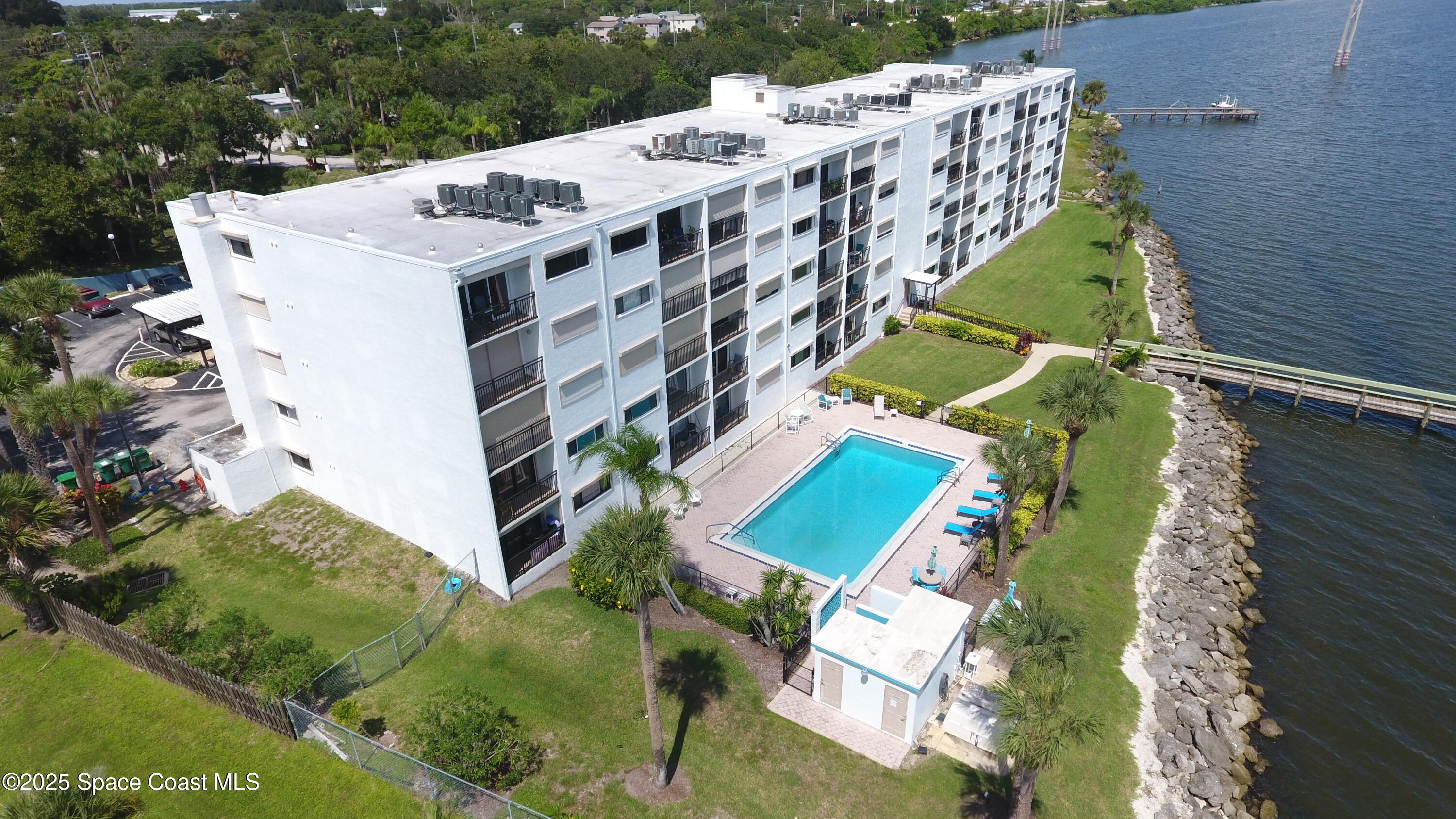 3901 Dixie Highway Northeast, Unit 402 Palm Bay, FL 32905 - Photo 5 of 33 an aerial view of a house with a yard