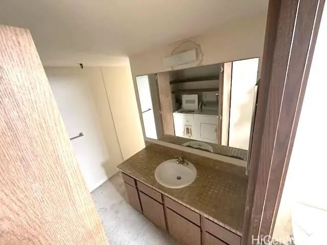 a bathroom with a sink and mirror