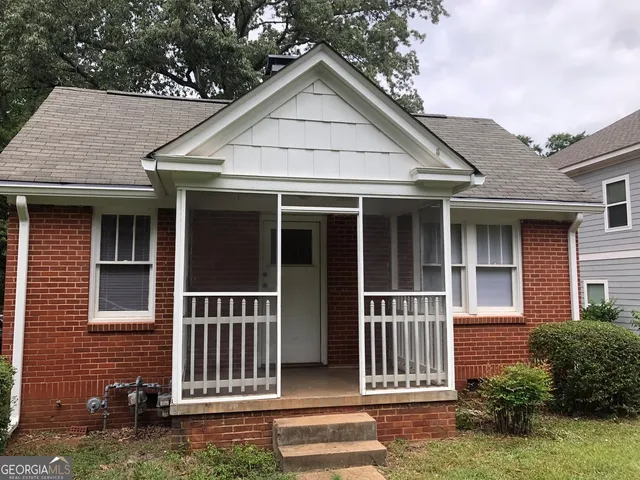 a view of outdoor space and front view of a house
