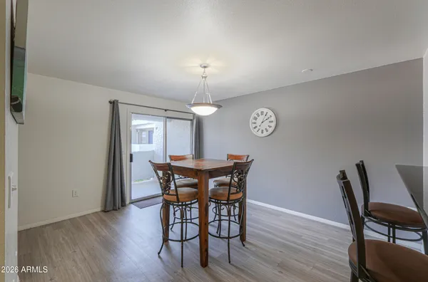a view of a dining room with furniture and wooden floor