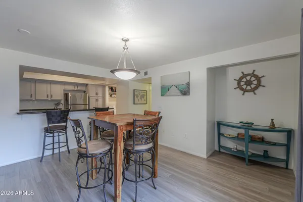 a view of a dining room with furniture and wooden floor