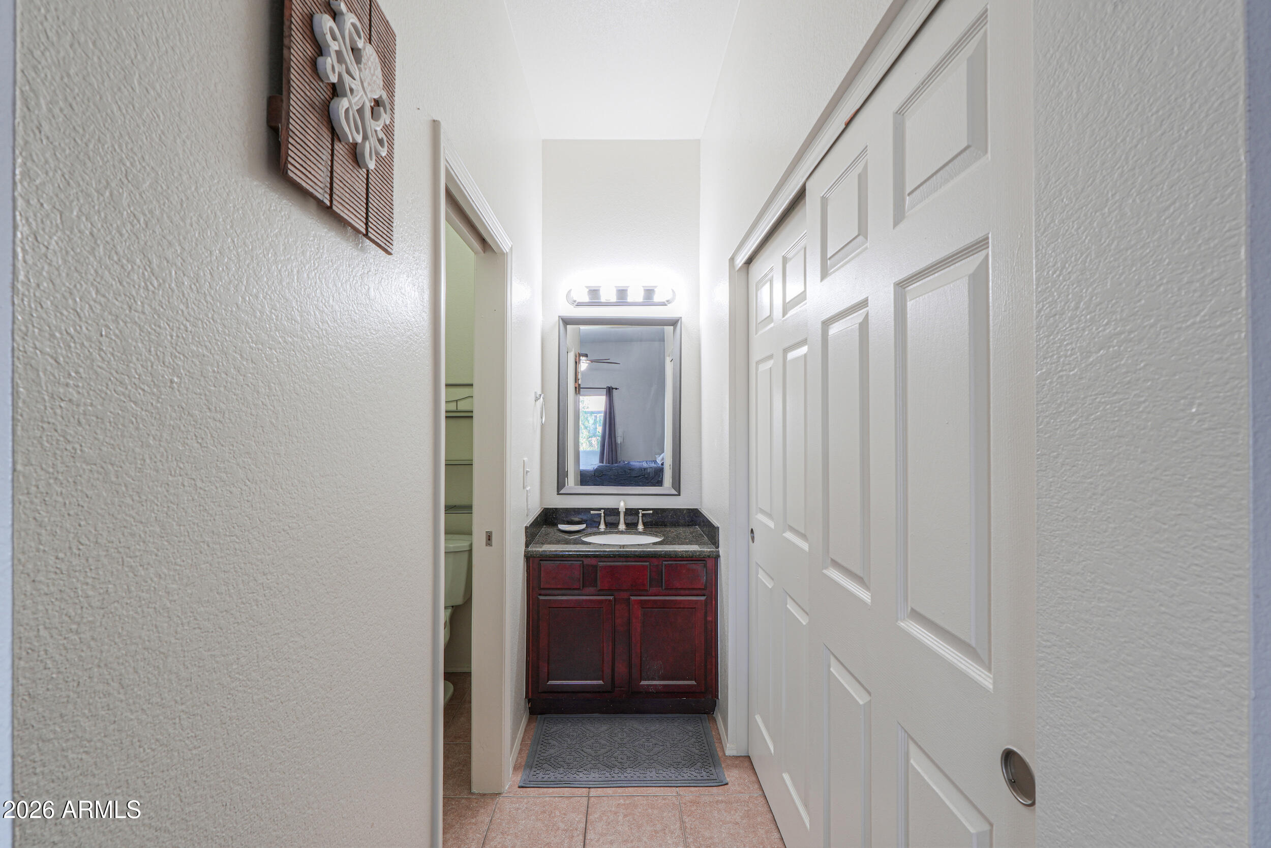 1331 West Baseline Road, Unit 225 Mesa, AZ 85202 - Photo 30 of 47 a room with a stove and a mirror