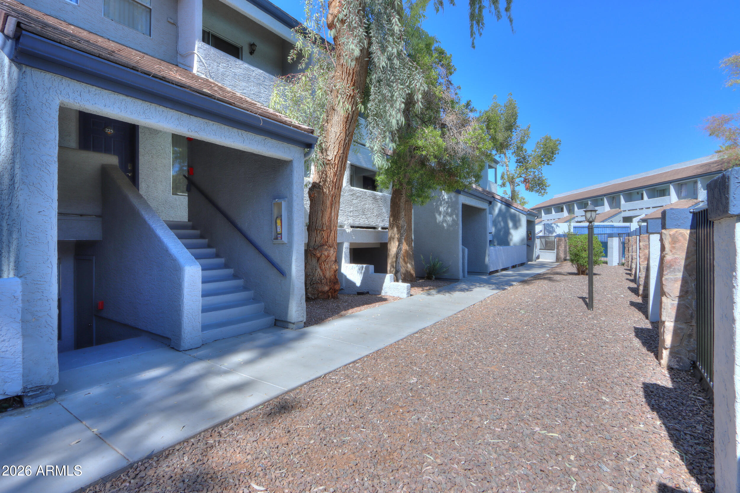 1331 West Baseline Road, Unit 225 Mesa, AZ 85202 - Photo 33 of 47 a view of a house with wooden stairs