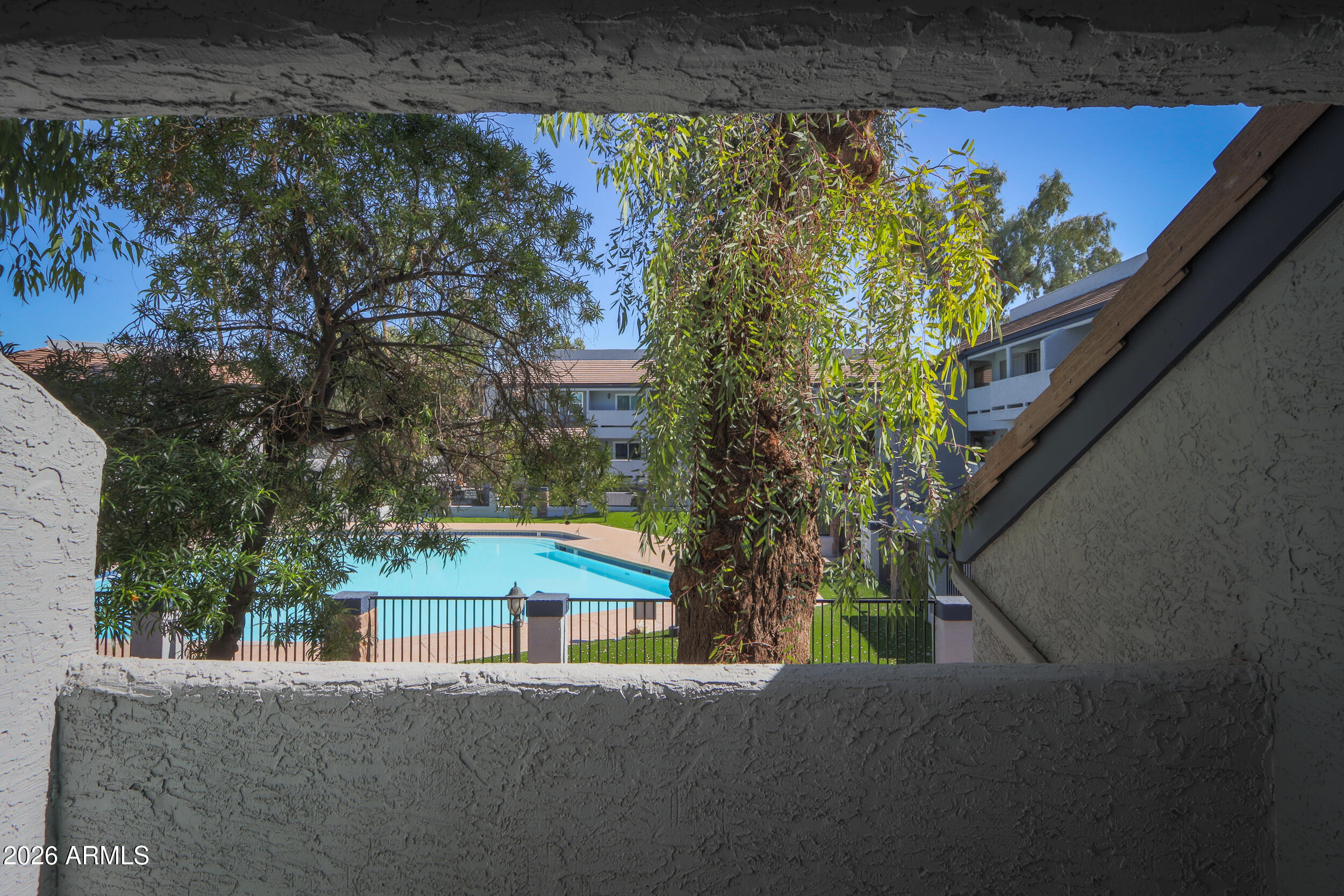 1331 West Baseline Road, Unit 225 Mesa, AZ 85202 - Photo 37 of 47 a view of a house with a yard and sitting area
