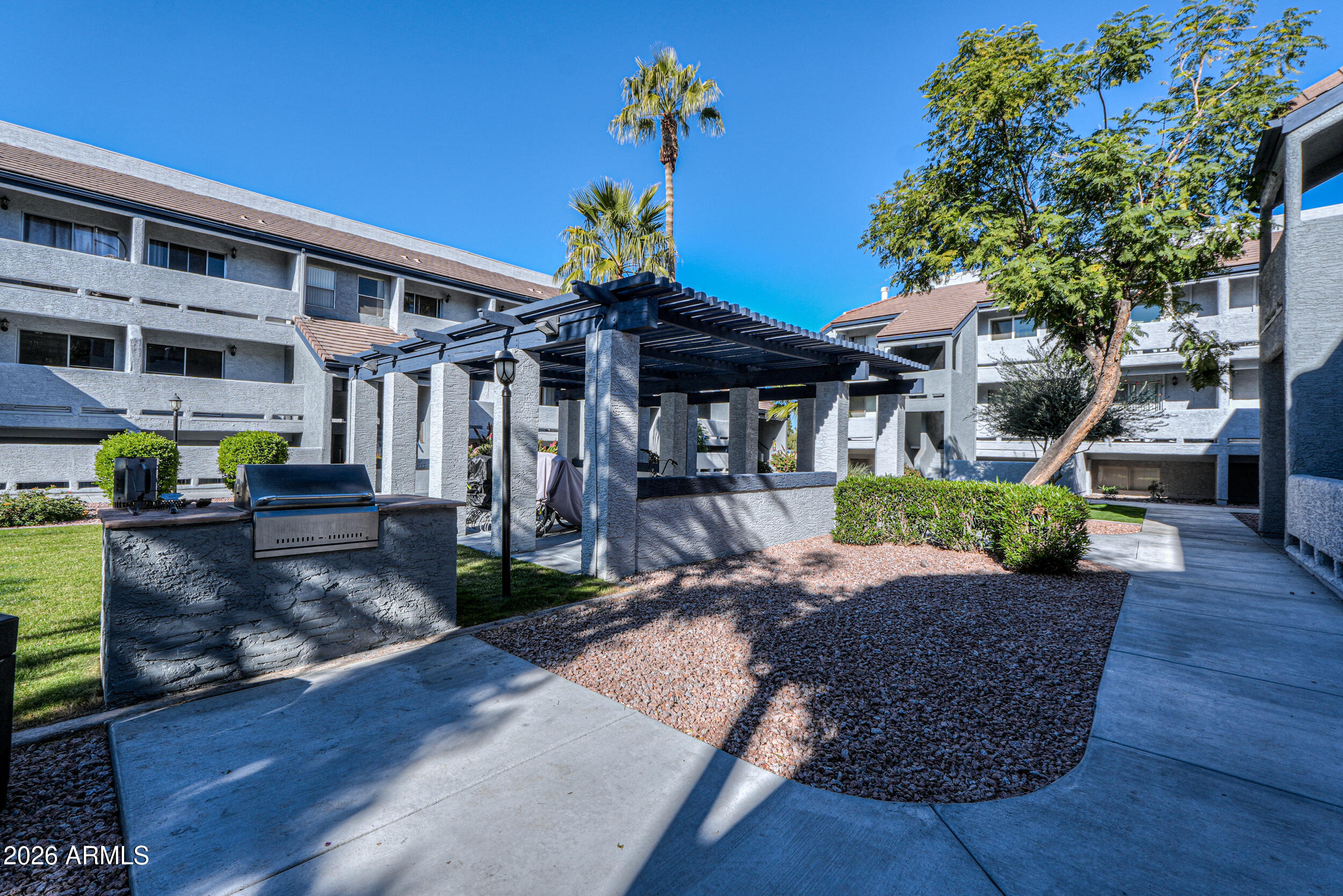 1331 West Baseline Road, Unit 225 Mesa, AZ 85202 - Photo 39 of 47 a front view of a house with garden