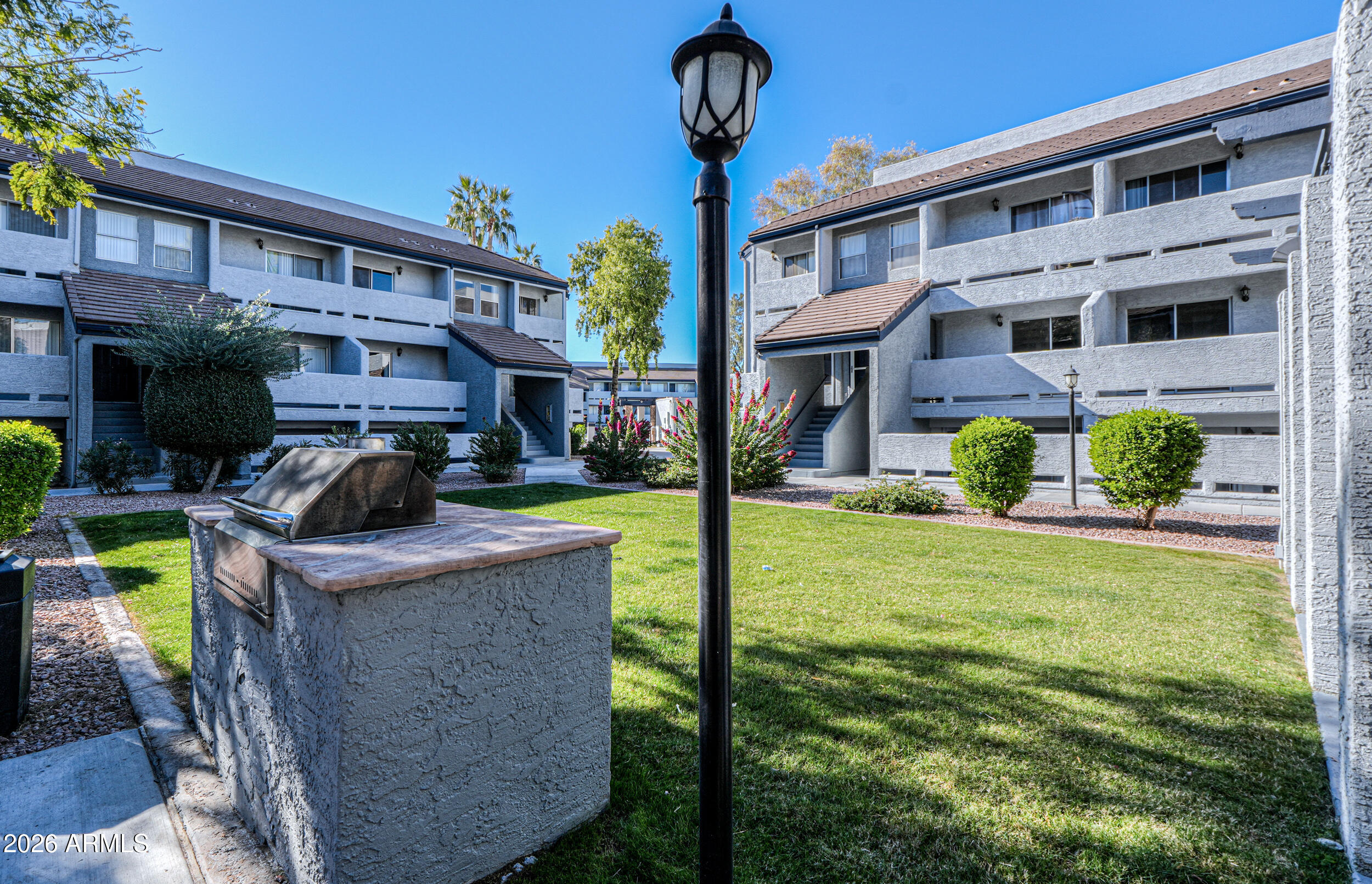 1331 West Baseline Road, Unit 225 Mesa, AZ 85202 - Photo 41 of 47 a front view of a house with garden