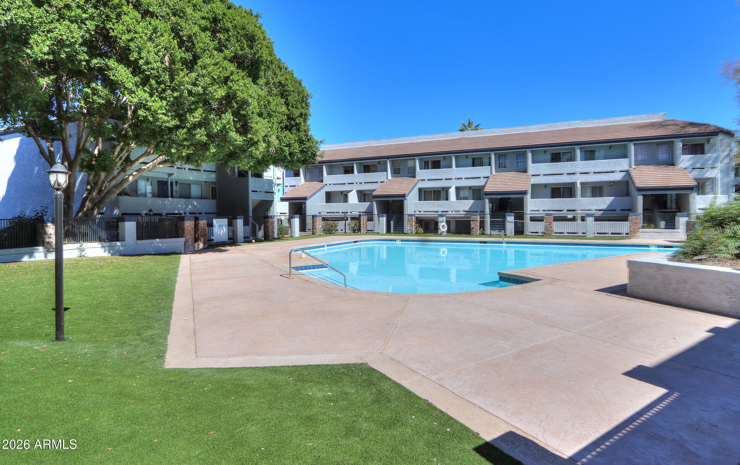 1331 West Baseline Road, Unit 225 Mesa, AZ 85202 - Photo 45 of 47 a view of a house with a swimming pool