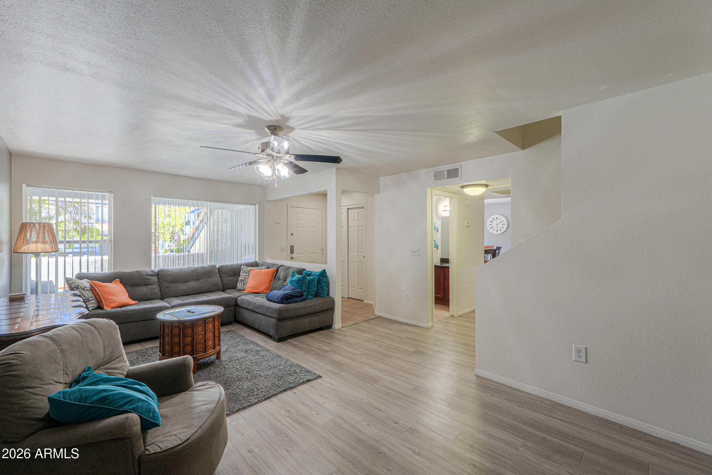 1331 West Baseline Road, Unit 225 Mesa, AZ 85202 - Photo 7 of 47 a living room with furniture and a large window